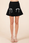 Two Bow Pleated Mini Skirt