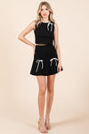 Two Bow Pleated Mini Skirt